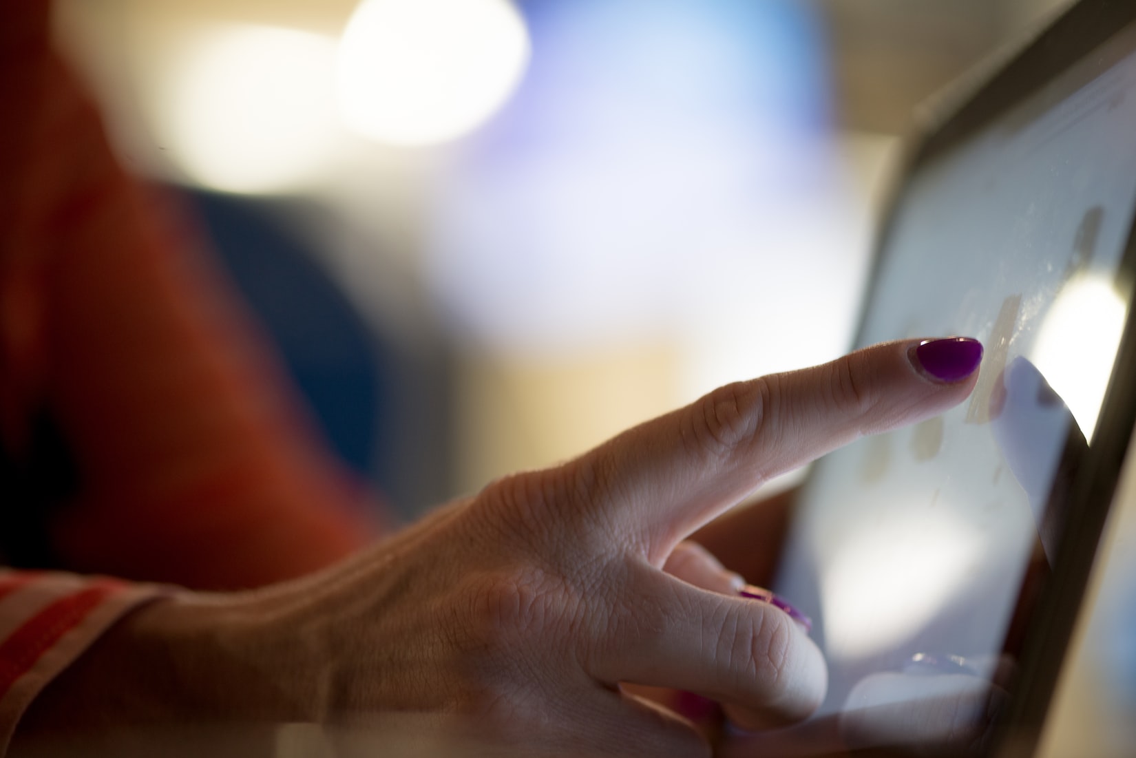 A hand testing an interactive digital surface