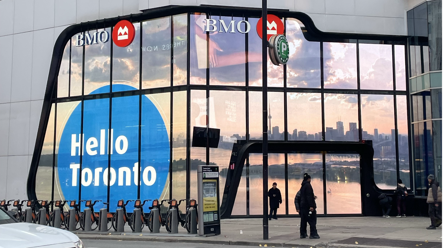 BMO glass facade transformed by a large transparent digital display in Toronto